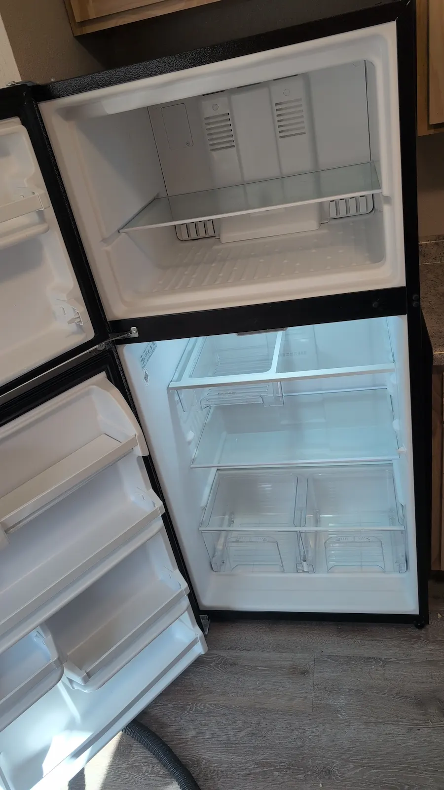 Clean refrigerator interior after food spills, stains, and grime were removed during a deep cleaning in Fargo, ND